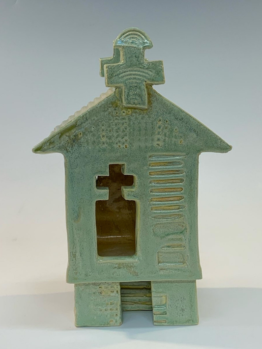 Green ceramic building with cut-outs