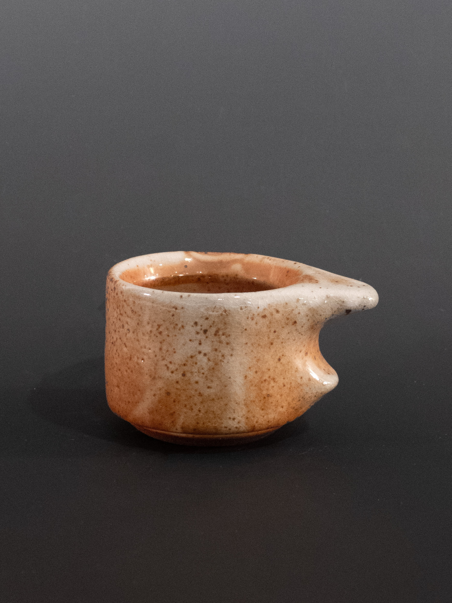 Ceramic cup on a dark background
