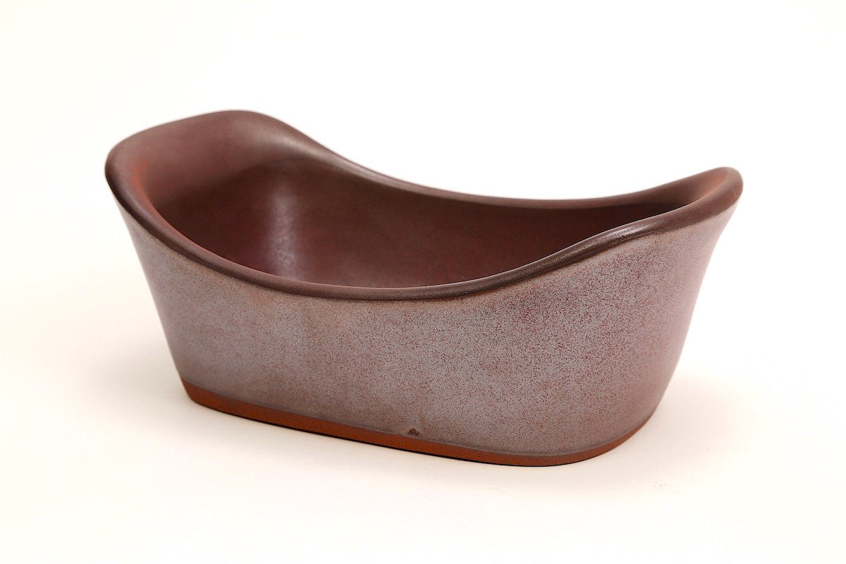 Brown ceramic bowl on a white background
