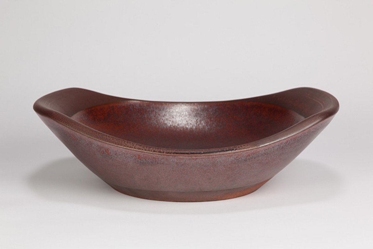 Brown ceramic bowl on a white background