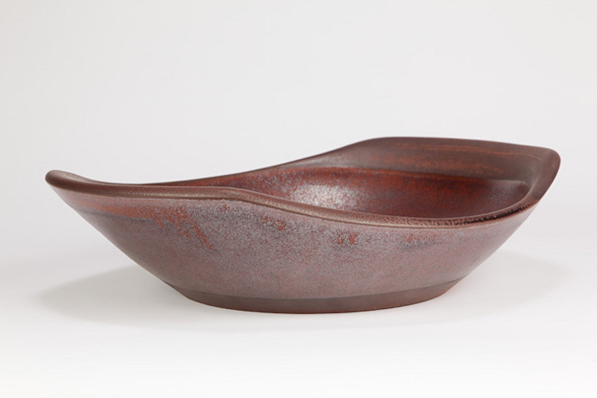 Brown ceramic bowl on a white background