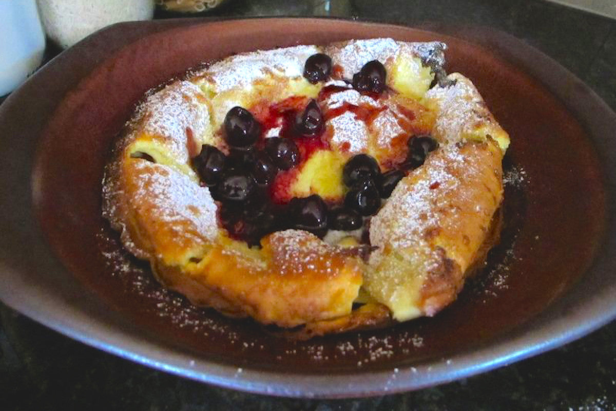 Pastry with berries on a brown bowl
