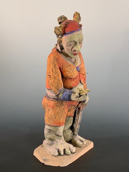 Colorful ceramic figure on a gradient background
