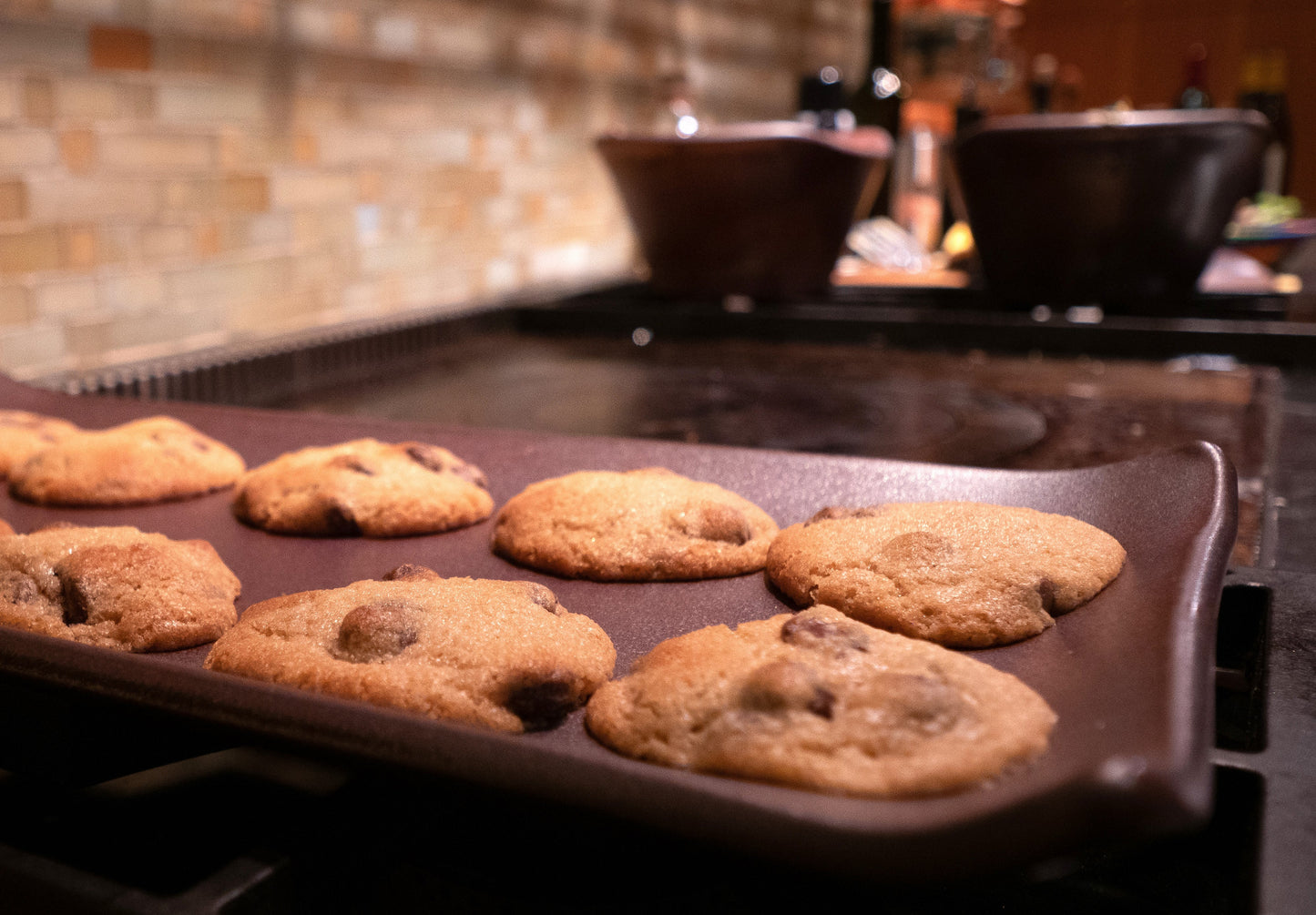 Baking tray with cookies on a stovetop