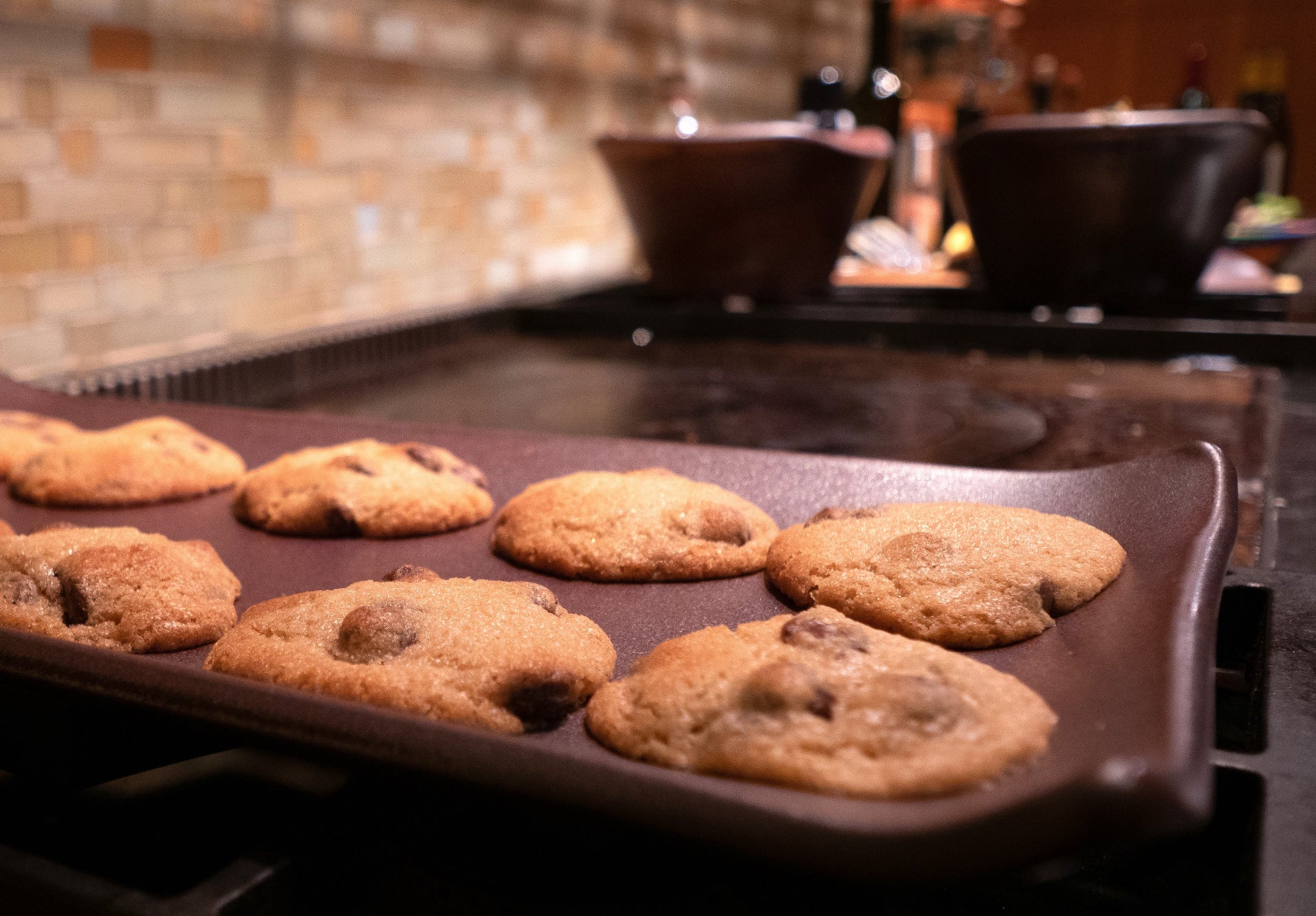 Baking tray with cookies on a stovetop