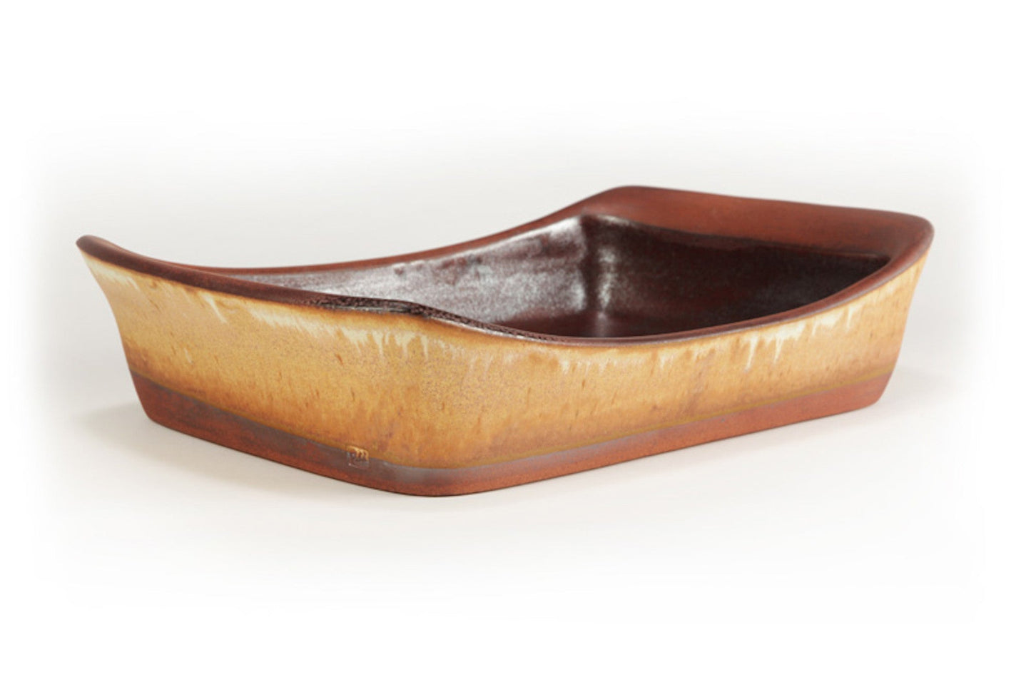 Ceramic boat-shaped dish with brown and beige gradient on a white background